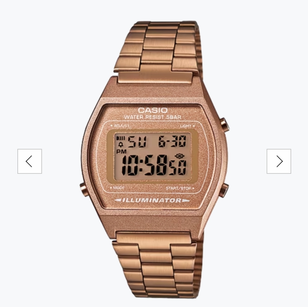 The digital vintage rose gold metal watch has a stainless steel band.
